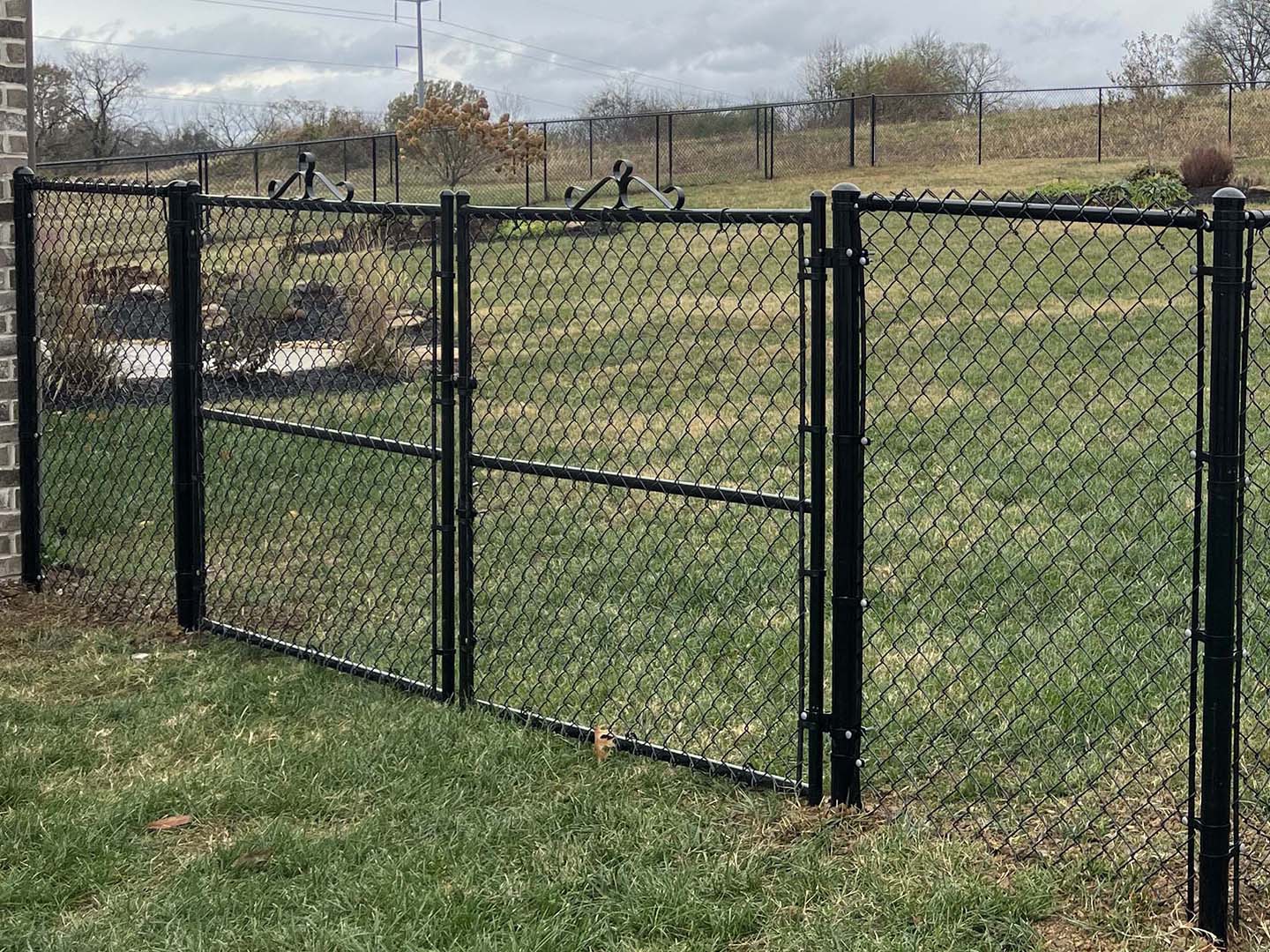 Black PVC-Coated Chain Link Fence with Double Gate in Middle Tennessee